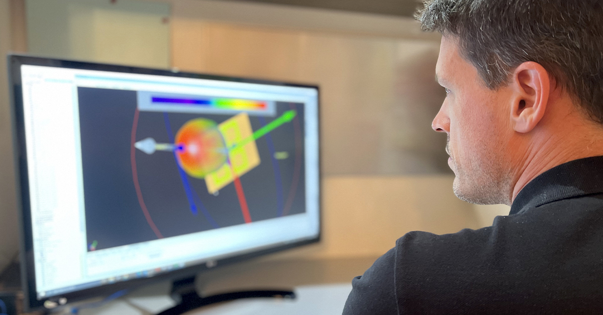 Hugo Chamberland looking at spectrum models at on a computer screen